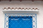 CHORONI'. Particolare di una finestra - il colore azzurro degli scuri su fondo bianco delle pareti mi ricordano la Grecia